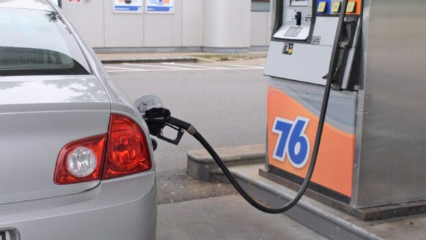 a car is parked at a gas pump