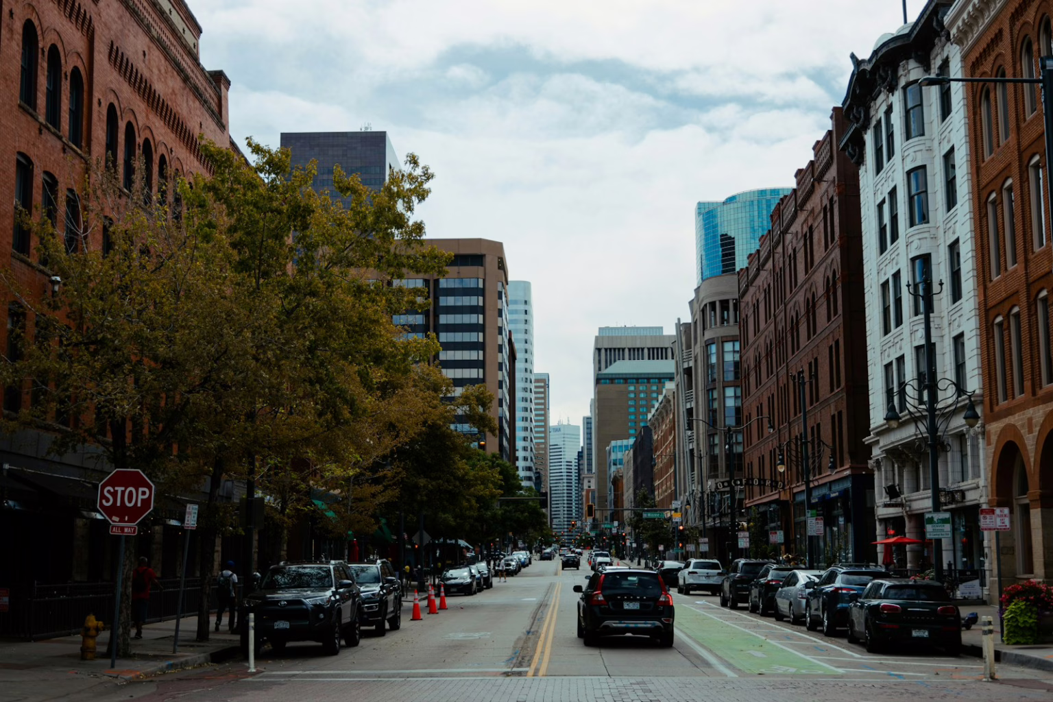 A city street filled with lots of tall buildings