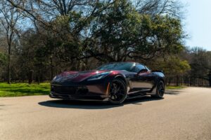 A black sports car parked on the side of the road