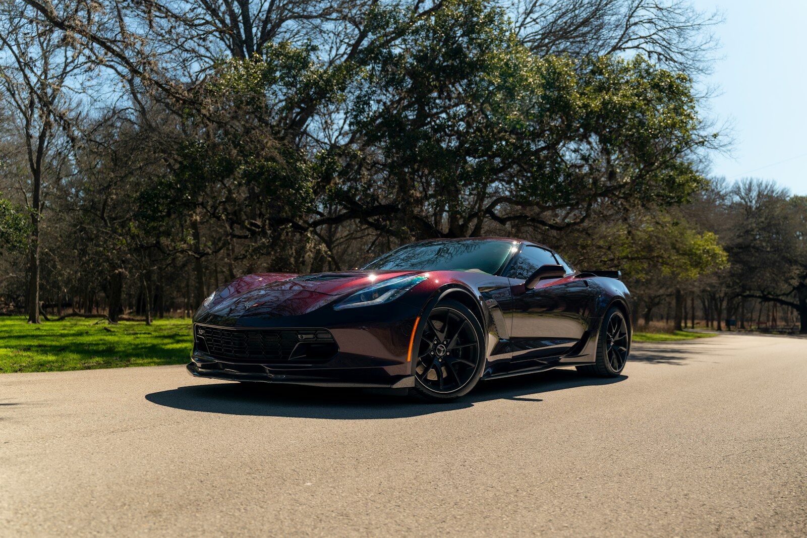 A black sports car parked on the side of the road