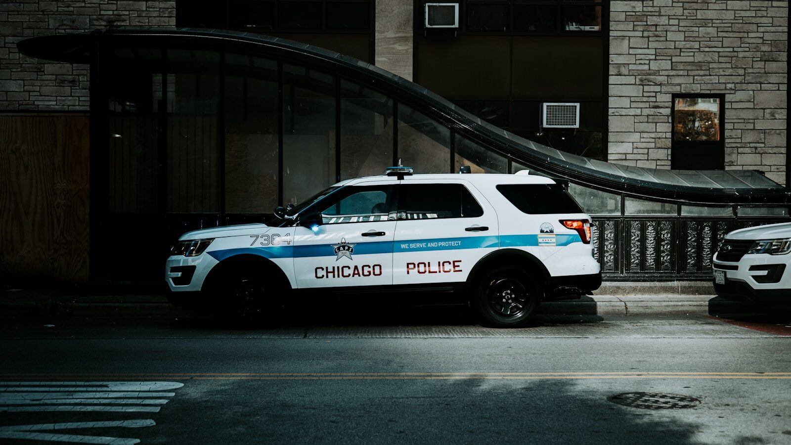 a police car parked in front of a building