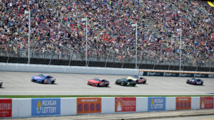 Cars race during the 2025 FireKeepers Casino 400 at Michigan International Speedway.