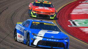 Denny Hamlin leads William Byron during a NASCAR Cup Series race at Phoenix Raceway.