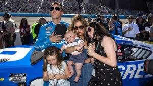 Denny Hamlin stands with fiancée Jordan Fish and their three children before the NASCAR Cup Series Championship race at Phoenix Raceway.