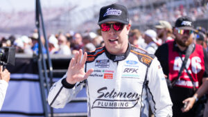Brad Keselowski walks through the garage area before a NASCAR Cup Series race weekend.