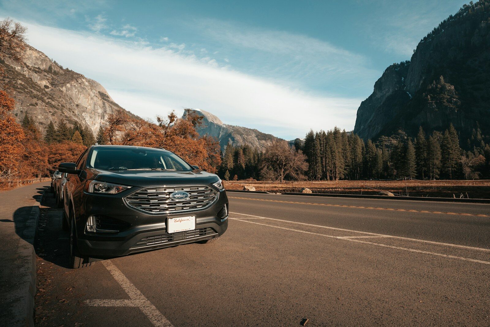 a car is parked on the side of the road