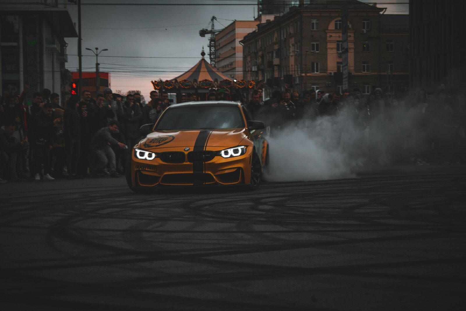 white and orange bmw m 3 on road during daytime