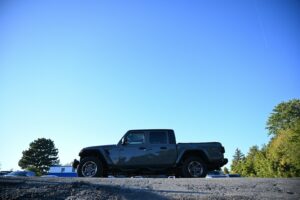 a jeep is parked on the side of the road
