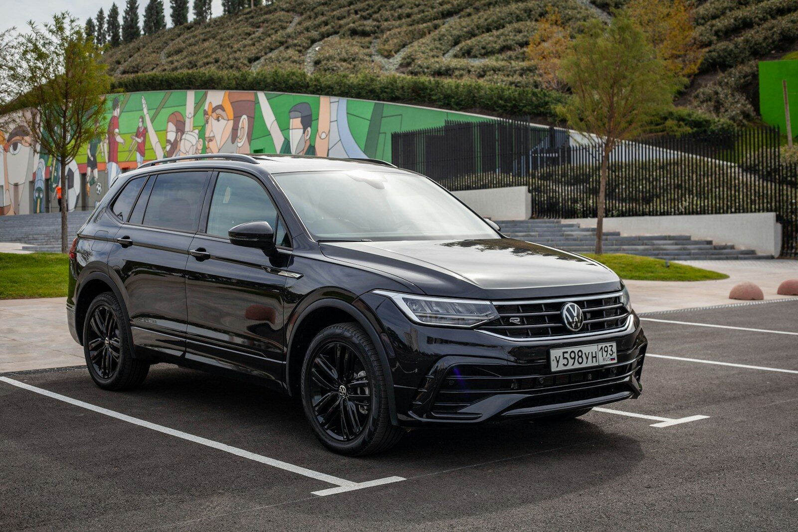 Black volkswagen tiguan parked in a lot