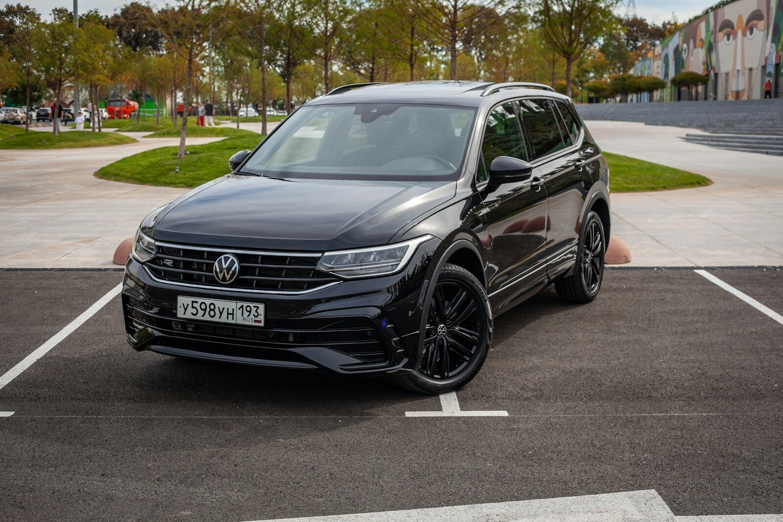 A black volkswagen tiguan parked on asphalt