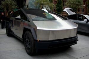 a silver car parked on the side of a street