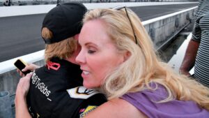NASCAR Xfinity Series driver Ty Gibbs (19) is hugged by his mother, Heather Gibbs, on Saturday, Aug. 12, 2023, after winnig the