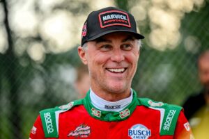 Former NASCAR Cup Series champion Kevin Harvick smiles during an autograph session before the 13th annual Masters of the Pros