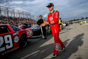 Former NASCAR Cup Series champion Kevin Harvick walks to his car before the 13th annual Masters of the Pros 200 race on